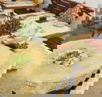 Flaming Cheese Wheel and Wine Experience Broadway - Accommodation Newcastle