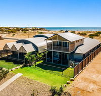 108 Madaffari Drive - Caretta - Luxurious Marina Home With A Spa and Free WiFi - Accommodation Newcastle